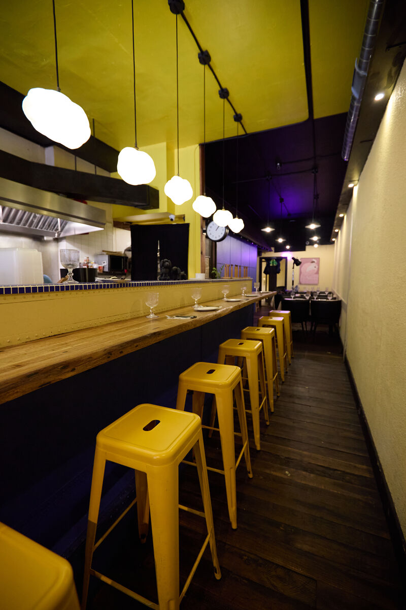 Sawaan home SAWAAN Thai Kitchen interior — open kitchen bar seating